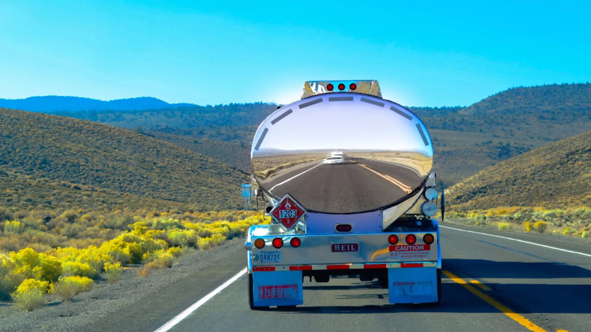 Polished fuel tanker truck on a highway (placeholder image)